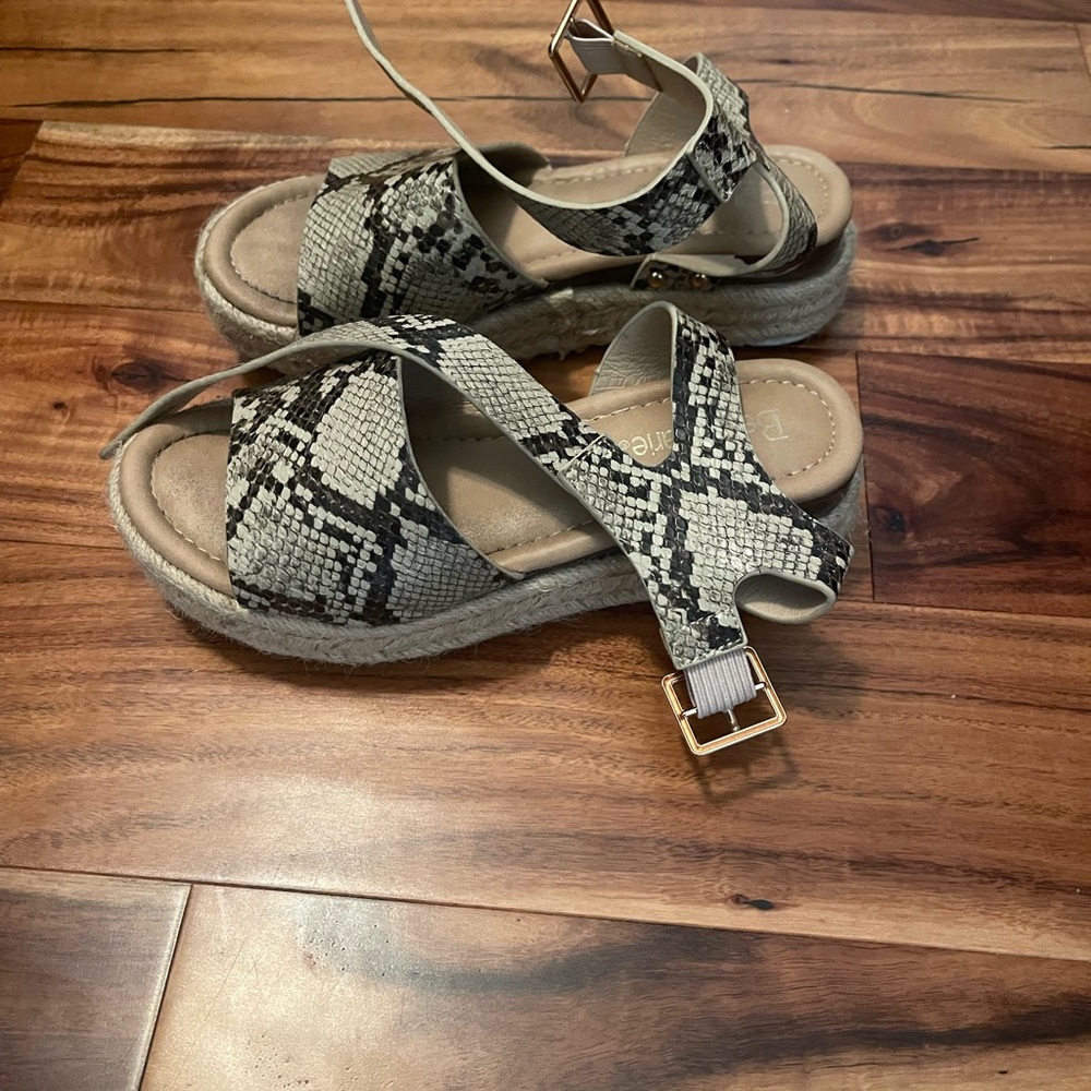 Snakeskin platform sandals.